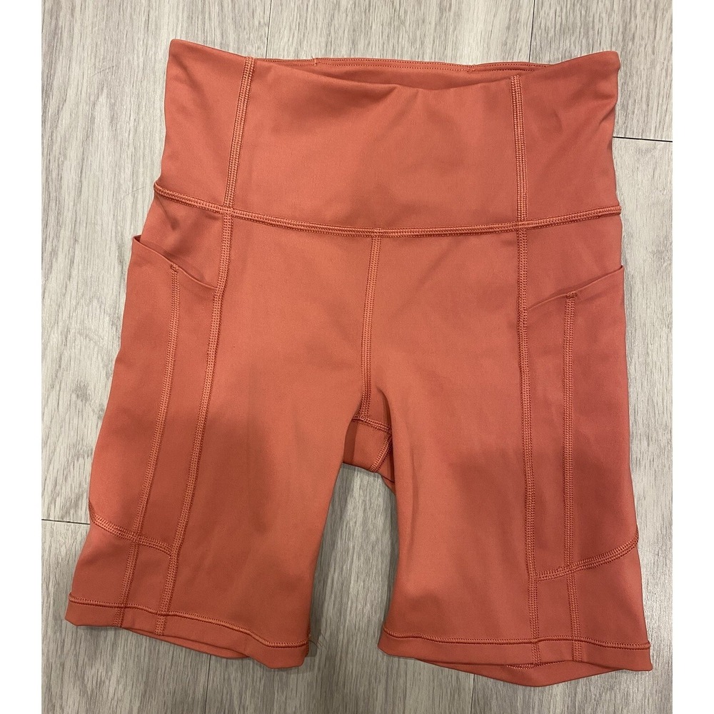 Athleta Ultimate Stash II 7" Burnt Orange Size XS Biker Shorts Compression